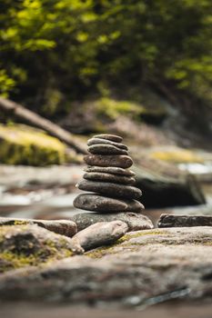 Stacked river stones on a mossy bed in the serene Georgia forest.