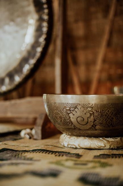 Close-up of a decorative singing bowl with intricate oriental patterns, conveying spirituality and tradition.